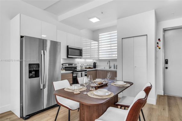 Dining room, Interior, Kitchen, Recessed Lighting, Stainless Steel Appliances, Wood Texture Flooring