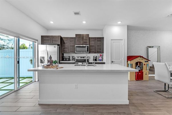 Interior, Kitchen, Recessed Lighting, Stainless Steel Appliances, Wood Texture Flooring