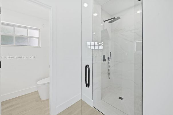 Bathroom, Glass Shower, Interior, Marble Walls, Recessed Lighting, Wood Texture Flooring
