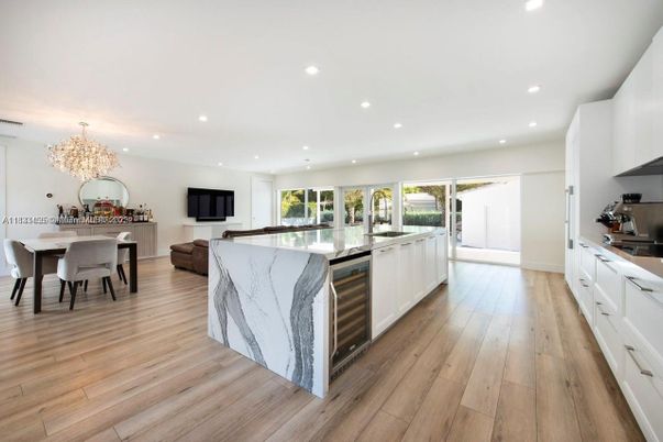 Chandelier, Dining room, Interior, Kitchen, Recessed Lighting, Stainless Steel Appliances, Wood Texture Flooring