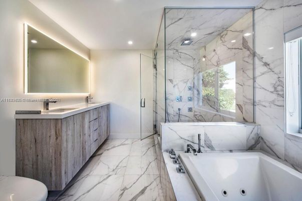 Bathroom, Dual Sink Vanities, Glass Shower, Interior, Marble, Marble Walls, Recessed Lighting