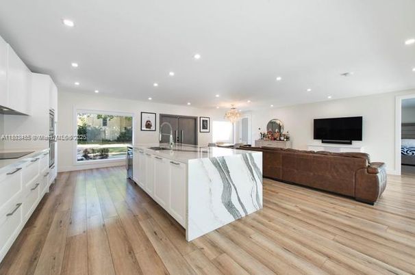 Chandelier, Interior, Kitchen, Living room, Recessed Lighting, Stainless Steel Appliances, Wood Texture Flooring