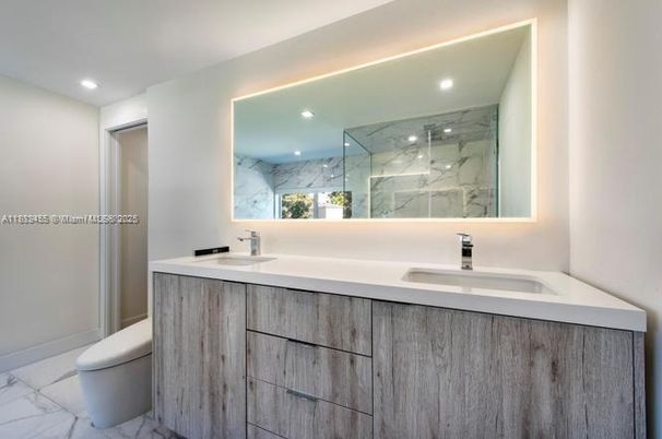 Bathroom, Dual Sink Vanities, Glass Shower, Interior, Marble, Marble Walls, Recessed Lighting