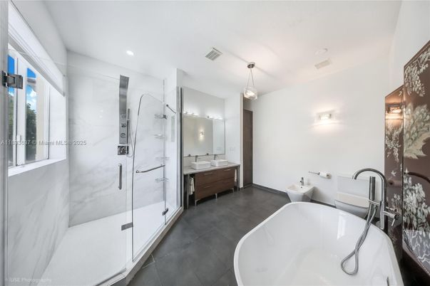 Bathroom, Dual Sink Vanities, Free Standing Baths, Glass Shower, Interior, Marble Walls, Pendant Lights, Recessed Lighting