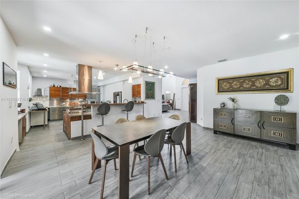 Dining room, Interior, Kitchen, Pendant Lights, Recessed Lighting, Stainless Steel Appliances, Wood Texture Flooring