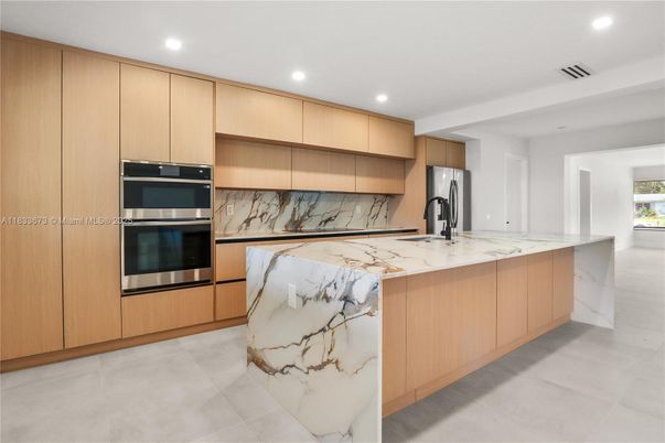 Interior, Kitchen, Marble Walls, Recessed Lighting, Stainless Steel Appliances