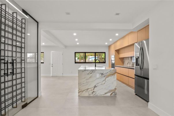 Interior, Kitchen, Marble Walls, Recessed Lighting, Stainless Steel Appliances