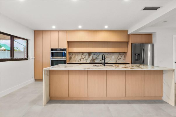 Interior, Kitchen, Marble Walls, Recessed Lighting, Stainless Steel Appliances