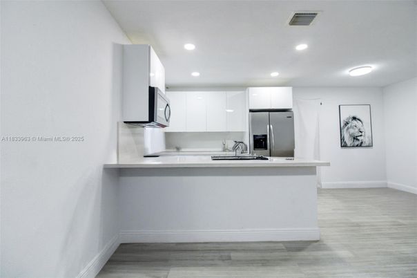 Interior, Kitchen, Recessed Lighting, Stainless Steel Appliances, Wood Texture Flooring
