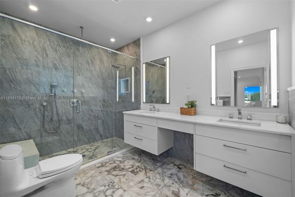 Bathroom, Dual Sink Vanities, Glass Shower, Interior, Marble, Marble Walls, Recessed Lighting