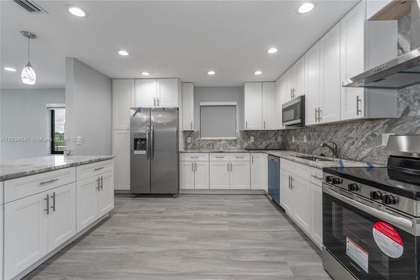 Interior, Kitchen, Pendant Lights, Recessed Lighting, Stainless Steel Appliances, Wood Texture Flooring