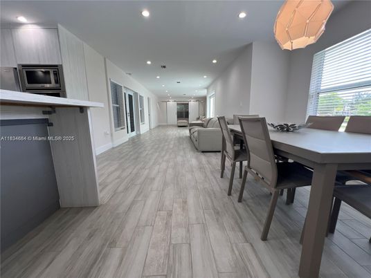 Dining room, Interior, Kitchen, Living room, Recessed Lighting, Stainless Steel Appliances, Wood Texture Flooring