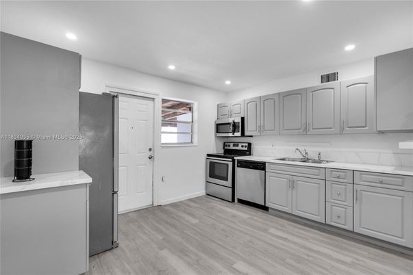 Interior, Kitchen, Recessed Lighting, Stainless Steel Appliances, Wood Texture Flooring