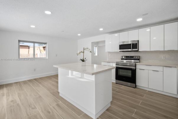 Interior, Kitchen, Recessed Lighting, Stainless Steel Appliances, Wood Texture Flooring
