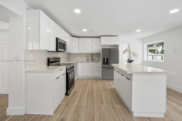 Interior, Kitchen, Recessed Lighting, Stainless Steel Appliances, Wood Texture Flooring