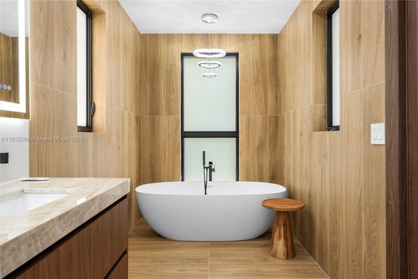 Bathroom, Dual Sink Vanities, Free Standing Baths, Interior, Wood Texture Flooring, Wooden Walls