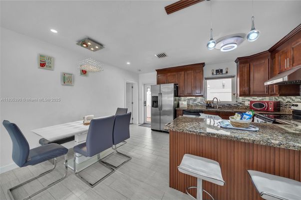 Dining room, Interior, Kitchen, Pendant Lights, Recessed Lighting, Stainless Steel Appliances, Wood Texture Flooring