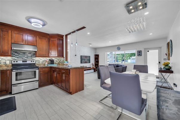 Dining room, Interior, Kitchen, Living room, Pendant Lights, Recessed Lighting, Stainless Steel Appliances, Wood Texture Flooring