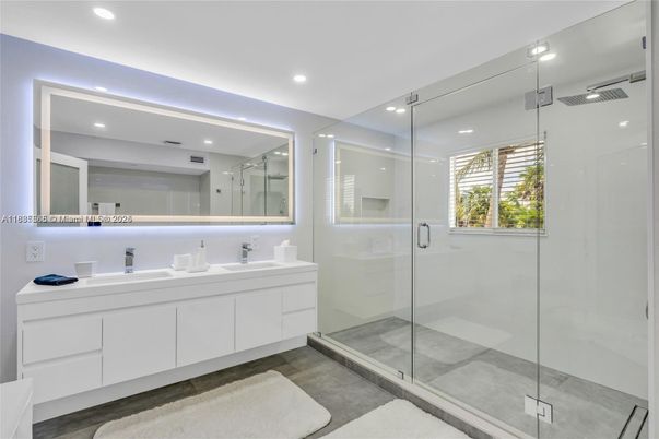 Bathroom, Dual Sink Vanities, Glass Shower, Interior, Recessed Lighting, Wood Texture Flooring