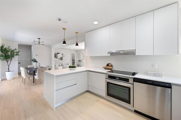 Dining room, Interior, Kitchen, Pendant Lights, Recessed Lighting, Stainless Steel Appliances, Wood Texture Flooring