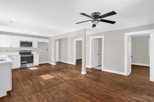 Empty room, Interior, Kitchen, Stainless Steel Appliances, Wood Texture Flooring