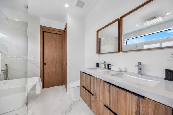 Bathroom, Dual Sink Vanities, Interior, Marble, Marble Walls, Recessed Lighting