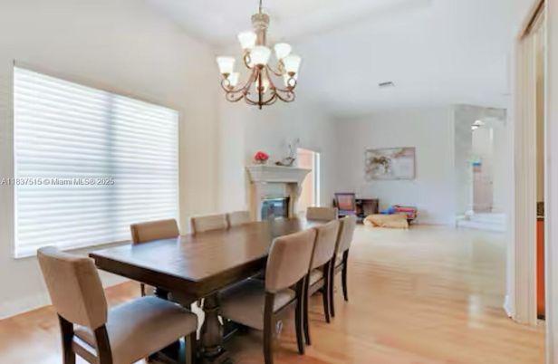 Chandelier, Dining room, Fireplace, Interior, Wood Texture Flooring