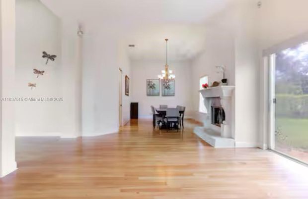 Chandelier, Dining room, Fireplace, Interior, Wood Texture Flooring