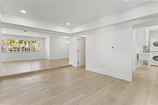 Empty room, Interior, Recessed Lighting, Utility Closets, Washer, Wood Texture Flooring