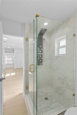 Bathroom, Glass Shower, Interior, Marble Walls, Recessed Lighting, Wood Texture Flooring
