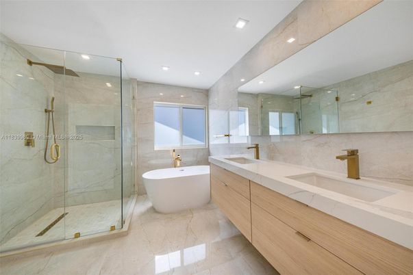 Bathroom, Dual Sink Vanities, Free Standing Baths, Glass Shower, Interior, Marble Walls, Recessed Lighting