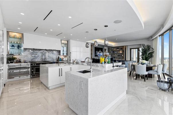 Dining room, Interior, Kitchen, Marble, Marble Walls, Pendant Lights, Recessed Lighting, Stainless Steel Appliances