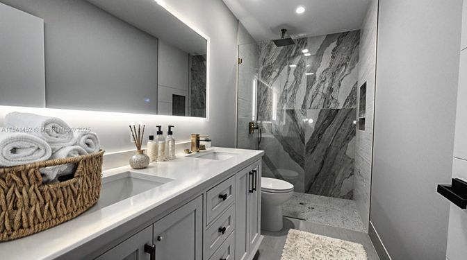 Bathroom, Dual Sink Vanities, Glass Shower, Interior, Marble Walls, Recessed Lighting