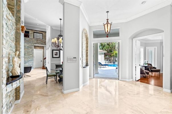 Chandelier, Interior, Marble, Pendant Lights, Recessed Lighting, Stone Walls, Wood Texture Flooring