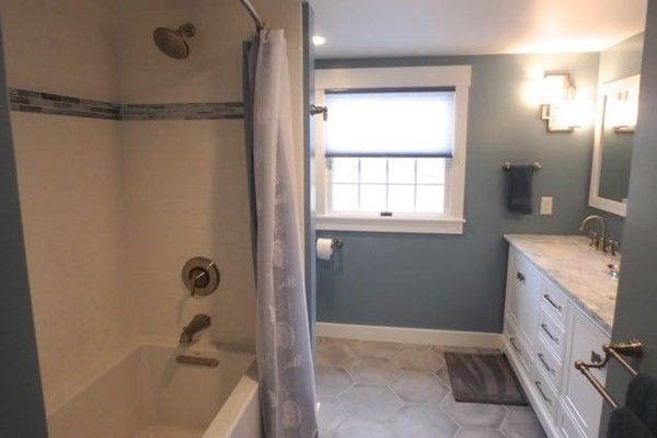 Interior, Bathroom, Recessed Lighting, Glass Shower, Ceramic Tile, Dual Sink Vanities