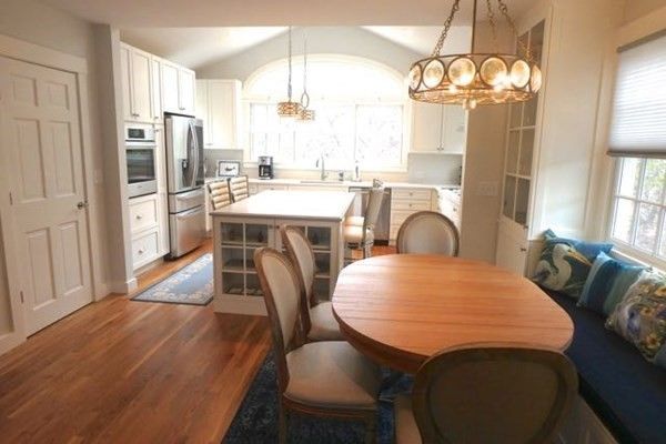 Interior, Kitchen, Wood Texture Flooring, Dining room, Chandelier, Stainless Steel Appliances