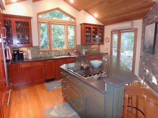 Interior, Kitchen, Wood Texture Flooring, Recessed Lighting, Wooden Ceilings, Stainless Steel Appliances, Stone Walls