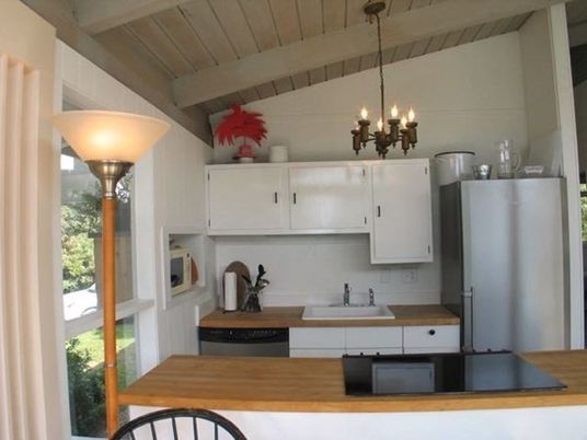 Interior, Kitchen, Wood Texture Flooring, Dining room, Chandelier, Stainless Steel Appliances