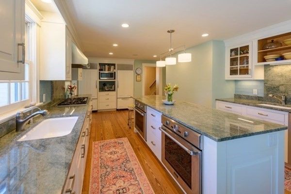 Interior, Kitchen, Wood Texture Flooring, Recessed Lighting, Stainless Steel Appliances, Pendant Lights