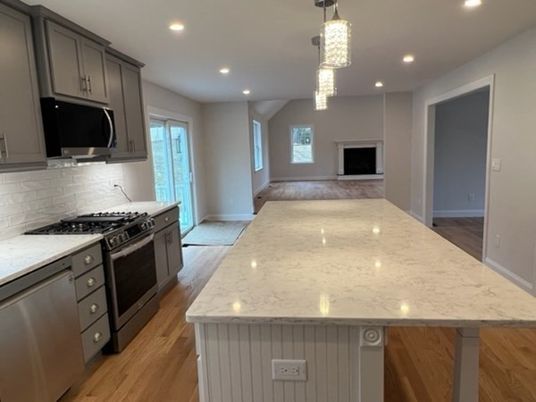 Fireplace, Interior, Kitchen, Pendant Lights, Recessed Lighting, Stainless Steel Appliances, Wood Texture Flooring