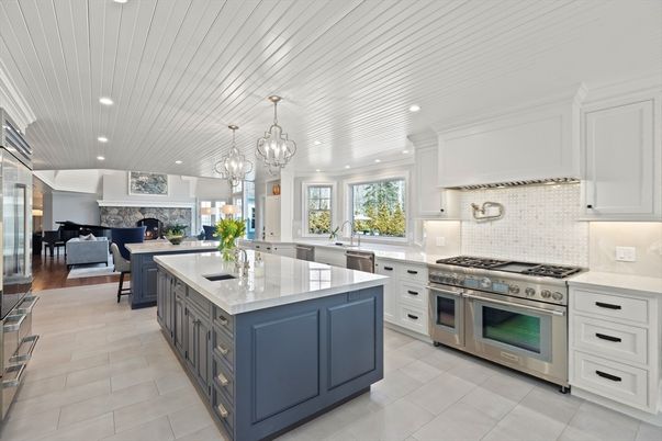 Chandelier, Dining room, Fireplace, Interior, Kitchen, Living room, Pendant Lights, Recessed Lighting, Stainless Steel Appliances