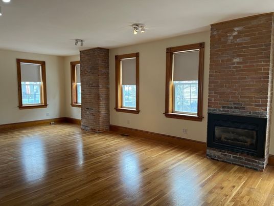 Empty room, Fireplace, Interior, Recessed Lighting, Stone Walls, Wood Texture Flooring