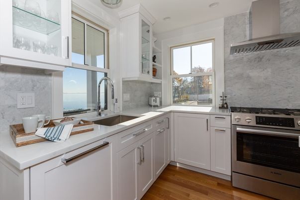 Interior, Kitchen, Marble Walls, Recessed Lighting, Stainless Steel Appliances, Wood Texture Flooring