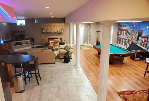 Billiard Table, Fireplace, Game Room, Interior, Living room, Recessed Lighting, Stone Walls, Wood Texture Flooring