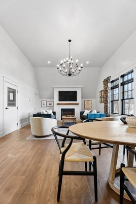 Chandelier, Dining room, Fireplace, Interior, Living room, Recessed Lighting, Wood Texture Flooring