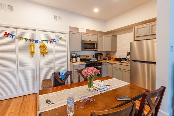 Dining room, Interior, Kitchen, Recessed Lighting, Stainless Steel Appliances, Wood Texture Flooring