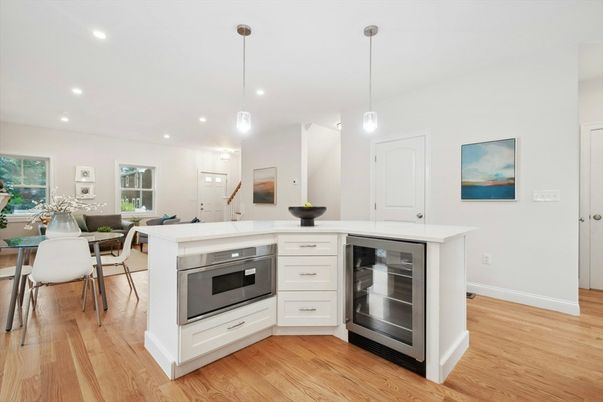 Dining room, Interior, Kitchen, Pendant Lights, Recessed Lighting, Stainless Steel Appliances, Wood Texture Flooring