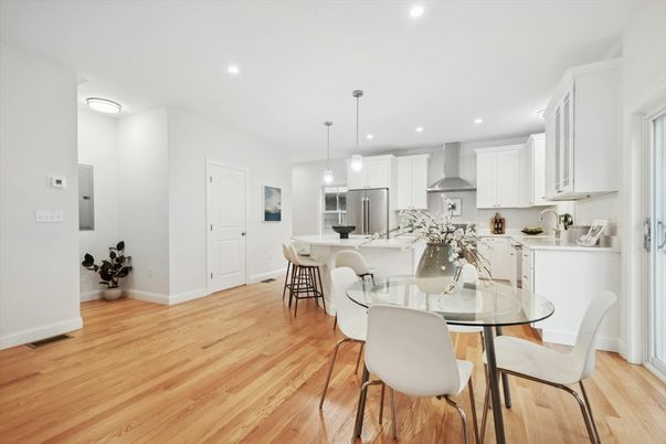 Dining room, Interior, Kitchen, Pendant Lights, Recessed Lighting, Stainless Steel Appliances, Wood Texture Flooring