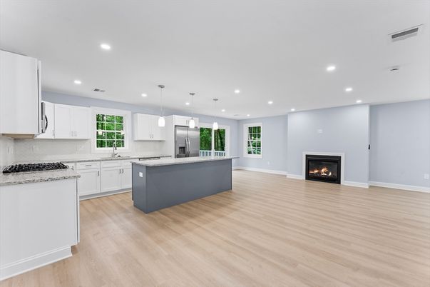 Fireplace, Interior, Kitchen, Pendant Lights, Recessed Lighting, Stainless Steel Appliances, Wood Texture Flooring