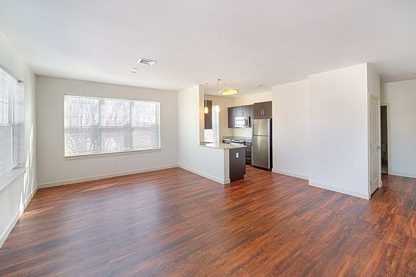 Empty room, Interior, Kitchen, Pendant Lights, Stainless Steel Appliances, Wood Texture Flooring